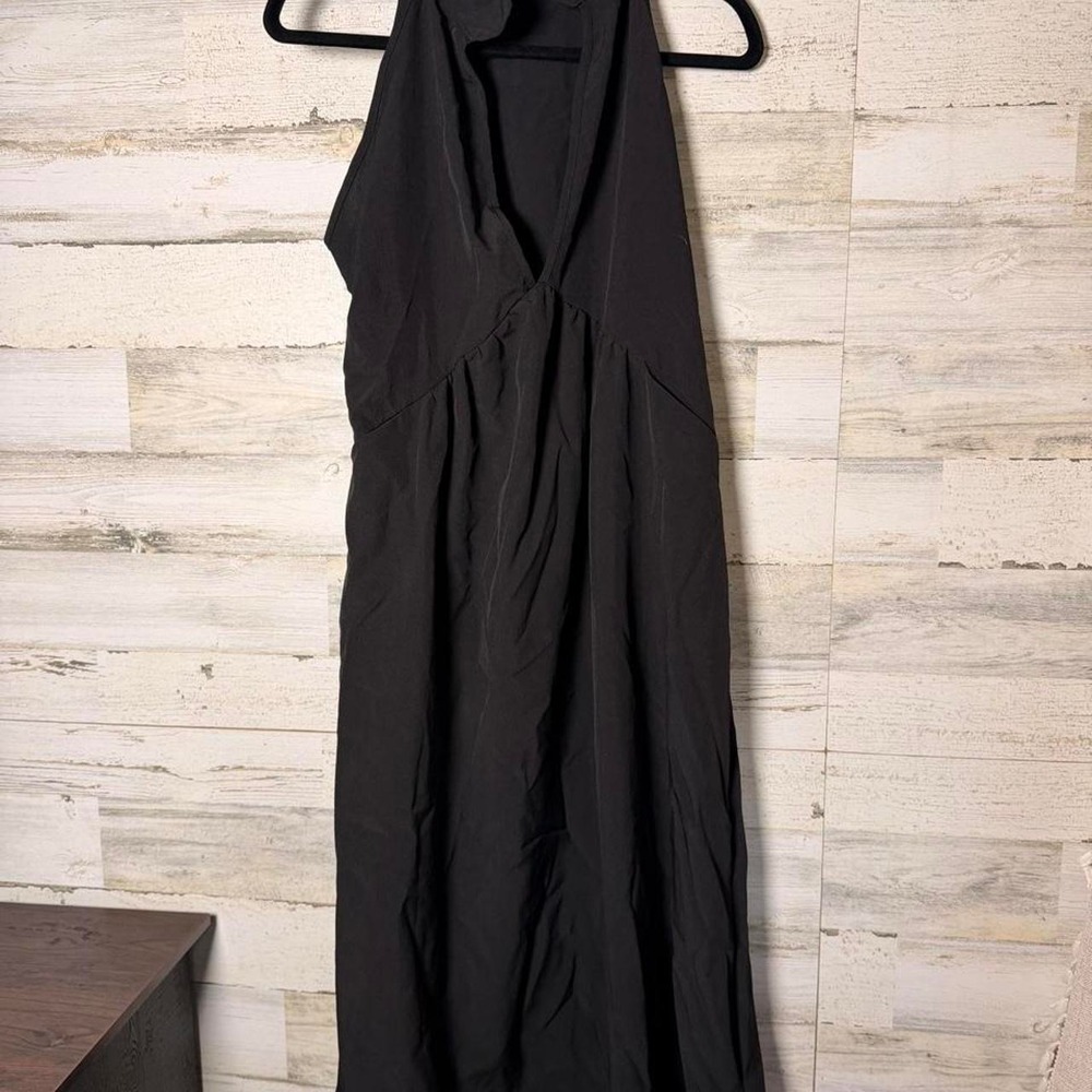 Black sleeveless maxi dress with a high mock neck